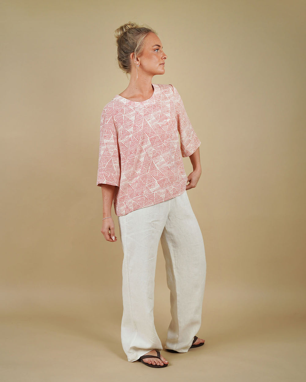 Woman wearing the High Waist Pants sewing pattern from Wardrobe by Me on The Fold Line. A pull-on trousers pattern made in cotton, viscose, linen, canvas or denim fabric, featuring a relaxed fit, elastic waist, and pockets.