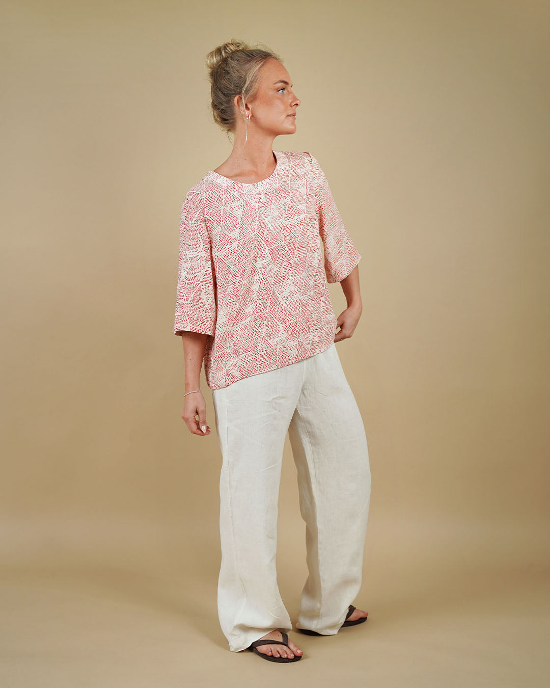 Woman wearing the High Waist Pants sewing pattern from Wardrobe by Me on The Fold Line. A pull-on trousers pattern made in cotton, viscose, linen, canvas or denim fabric, featuring a relaxed fit, elastic waist, and pockets.