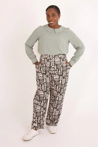 Woman wearing the Jacinta Blouse sewing pattern from Sew Over It on The Fold Line. A top pattern made in viscose, crepe, silk, georgette, or cotton lawn fabric, featuring a round neckline, flat collar, long puff sleeves with cuffs, and a keyhole opening at the back.