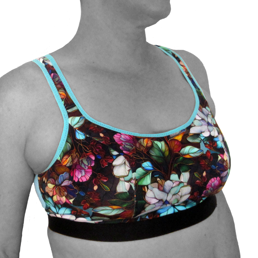 Woman wearing the Kori Bralette sewing pattern from Primrose Dawn on The Fold Line. A bralette pattern made in athletic knit, cotton/spandex jersey, scuba, liverpool, or stretch mesh fabric, featuring princess seams, a scoop neckline, and wide straps.