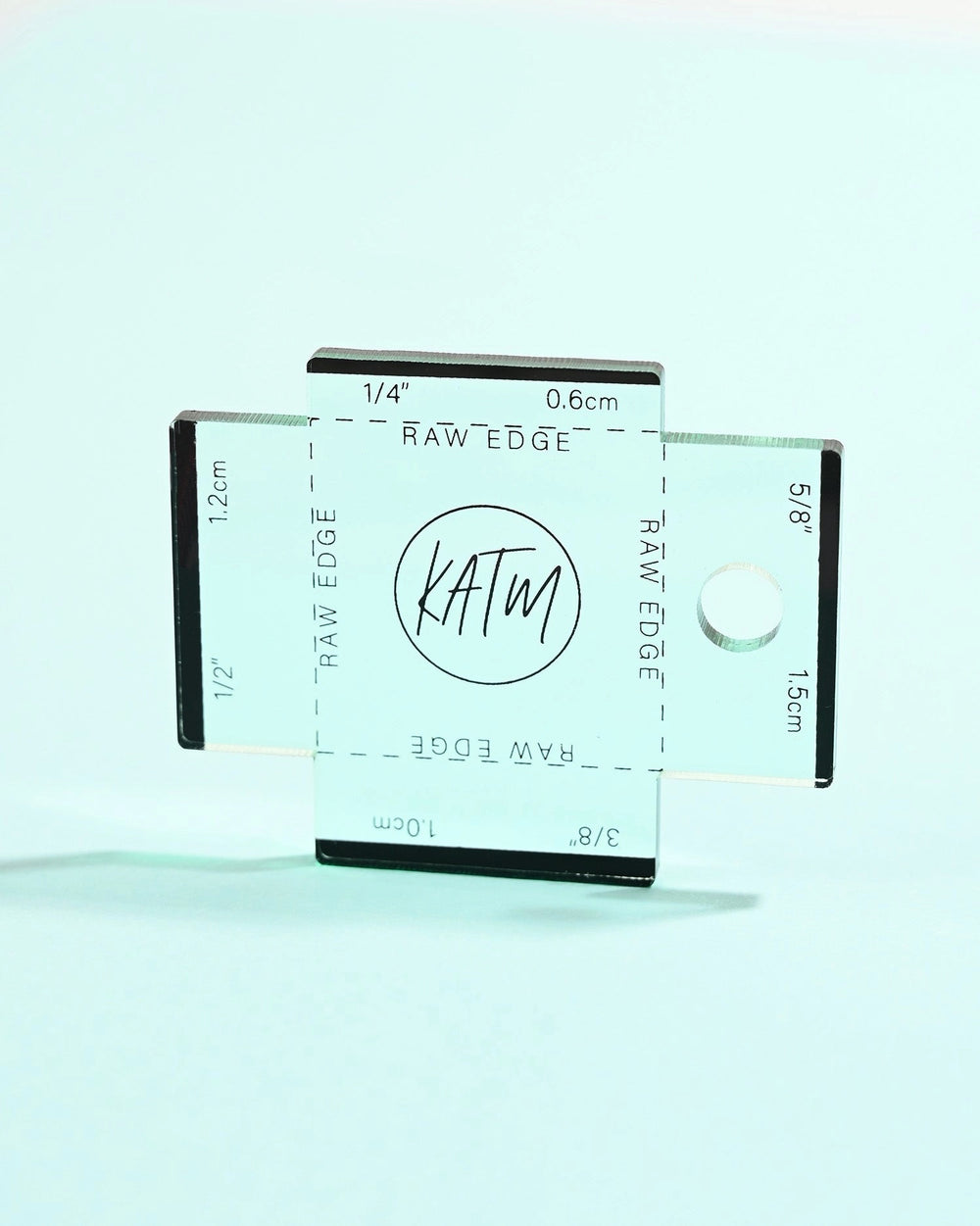 The Label Gauge from Kylie & The Machine on The Fold Line. This tea green acrylic gauge with laser-etched measurements will help you to position your label perfectly.
