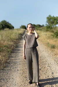 Woman wearing the Lea Top and Pants sewing pattern from Silversaga Patterns on The Fold Line. A top and trousers pattern made in linen, hemp, soft cottons, cotton block prints, linen blends, tencel twill, or rayon/viscose fabric, featuring a top with a round neckline and grown-on short sleeves, and trousers with a high elasticated waist and in-seam pockets.