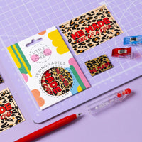 The Leopard Label and Patch Pack from Little Rosy Cheeks on The Fold Line. The pack includes 2 woven labels and 2 paper patches with red text on a leopard print background, ready to be sewn onto your handmade clothes.