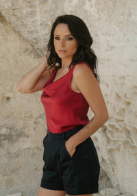 Woman wearing the Lioness Top sewing pattern from Maison Fauve on The Fold Line. A sleeveless top pattern made in cotton, viscose, linen, tencel, or silk fabric, featuring a bias cut, wide straps, and draped cowl neckline.