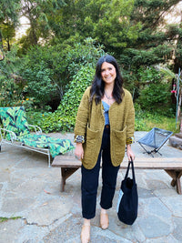 Woman wearing the Liz Quilted Liner Jacket sewing pattern from Daisy Chain Patterns on The Fold Line. A jacket pattern made in cotton lawn or poplin, quilting cotton, lightweight canvas, linen or linen blend fabric, featuring a relaxed fit, oversized pockets, and a subtle high-low hem.