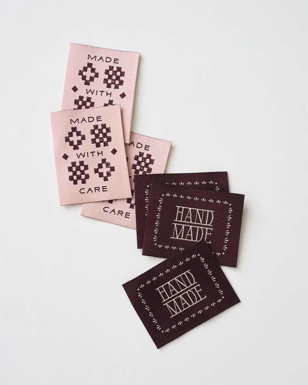 'Made with Care Sketchy Quilt Pink' woven labels from Matchy Matchy Sewing Club on The Fold Line. The pack includes 6 woven labels to sew onto your handmade clothes and accessories.