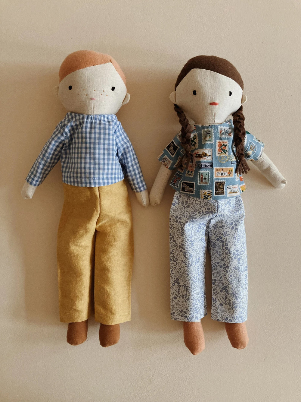 Dolls wearing the March Doll Clothing sewing pattern from Me & Kiddo Patterns on The Fold Line. A doll clothes pattern made in linen or cotton fabric, featuring a short or long sleeve shirt and trousers.