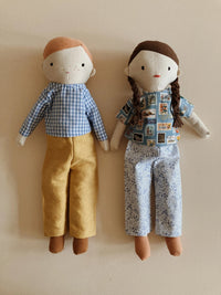 Dolls wearing the March Doll Clothing sewing pattern from Me & Kiddo Patterns on The Fold Line. A doll clothes pattern made in linen or cotton fabric, featuring a short or long sleeve shirt and trousers.
