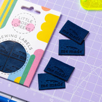 The 'Me Made Star Blue Velvet' woven labels from Little Rosy Cheeks on The Fold Line. The pack includes 4 labels with laser-engraved shooting stars on a blue velvet background, ready to be sewn into your handmade clothes.