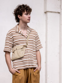 Man wearing the Men's Cuba Shirt sewing pattern from Notches on The Fold Line. A shirt pattern made in viscose, tencel, cotton, chambray, linen, or knit fabric, featuring a Cuban (camp) collar, button front, and short sleeves.