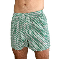Man wearing the Men's Hugo Boxers sewing pattern from Dhurata Davies Patterns on The Fold Line. An underwear pattern made in cotton lawn, poplin, percale, voile, sateen, lightweight linen, or linen blend fabric, featuring a relaxed fit, elasticated waist, front fly with a button, and shaped back with a centre panel.