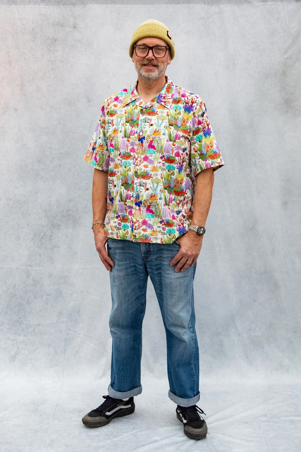 Man wearing the Men's Tony Shirt sewing pattern from Emporia Patterns on The Fold Line. A shirt pattern made in cotton or linen fabric, featuring a loose fit, open collar, button front, and short sleeves.
