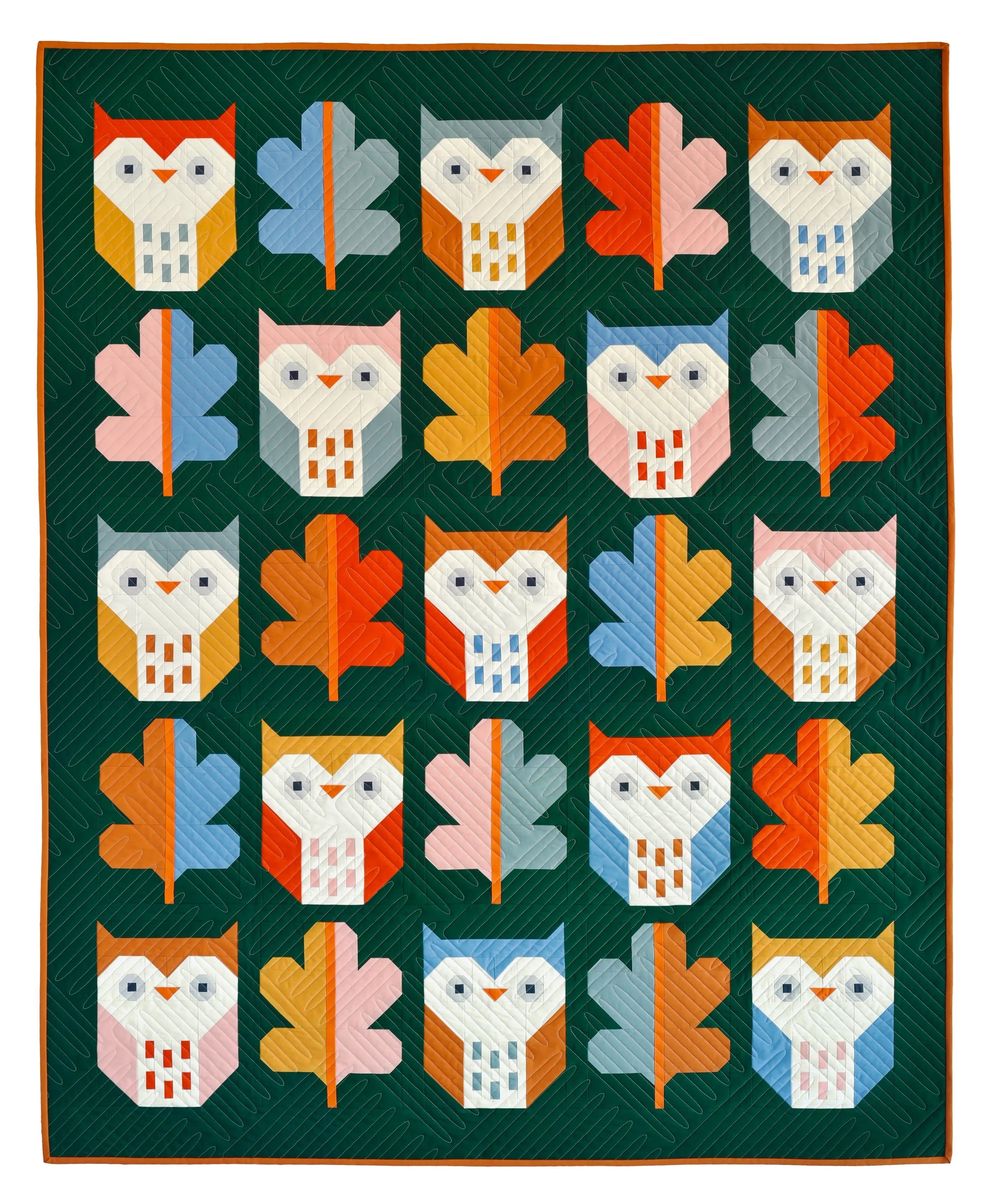 The Night Owl Quilt sewing pattern from Pen + Paper Patterns on The Fold Line. A quilt pattern made in quilting cotton fabric, featuring a traditionally pieced owl and leaf motif. 