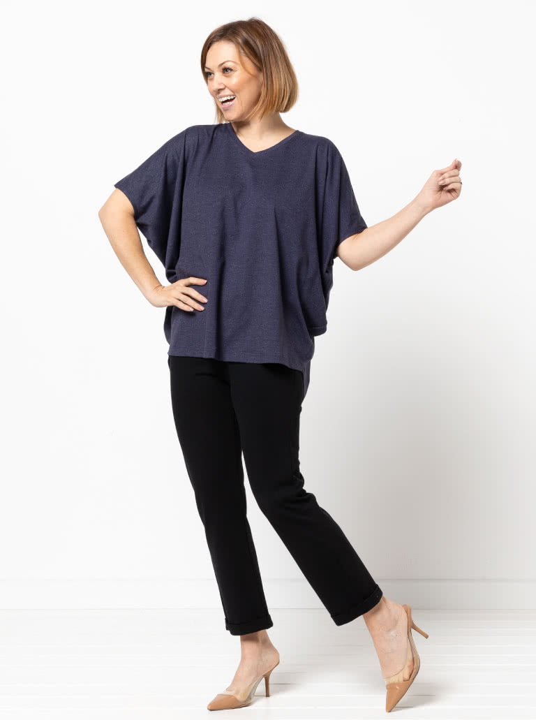 Woman wearing the Parker Ponte Pant sewing pattern from Style Arc on The Fold Line. A pants pattern made in ponte, stretch woven, or bengaline fabric, featuring an elastic waist, straight cuffed leg, and ankle length.