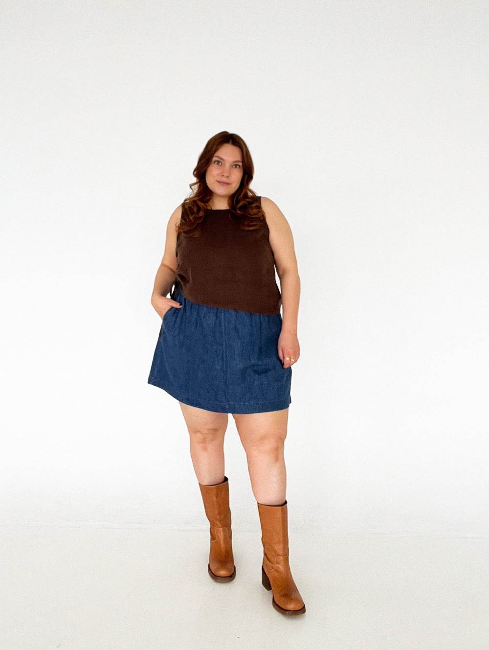 Woman wearing the Playback Skort sewing pattern from Les Perlines on The Fold Line. A skort pattern made in cotton, linen, twill, corduroy, or denim fabric, featuring an elasticated waistband, side pockets, and mini length. 