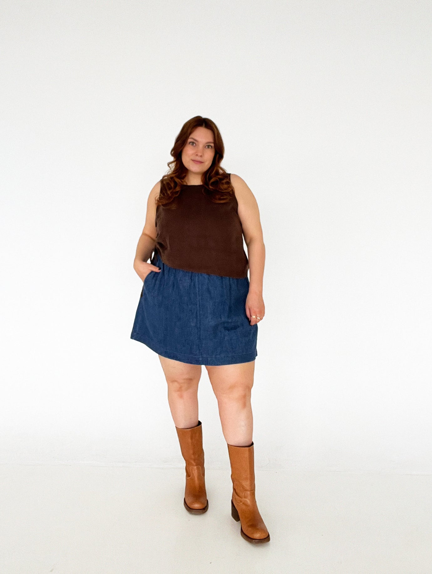 Woman wearing the Playback Skort sewing pattern from Les Perlines on The Fold Line. A skort pattern made in cotton, linen, twill, corduroy, or denim fabric, featuring an elasticated waistband, side pockets, and mini length. 