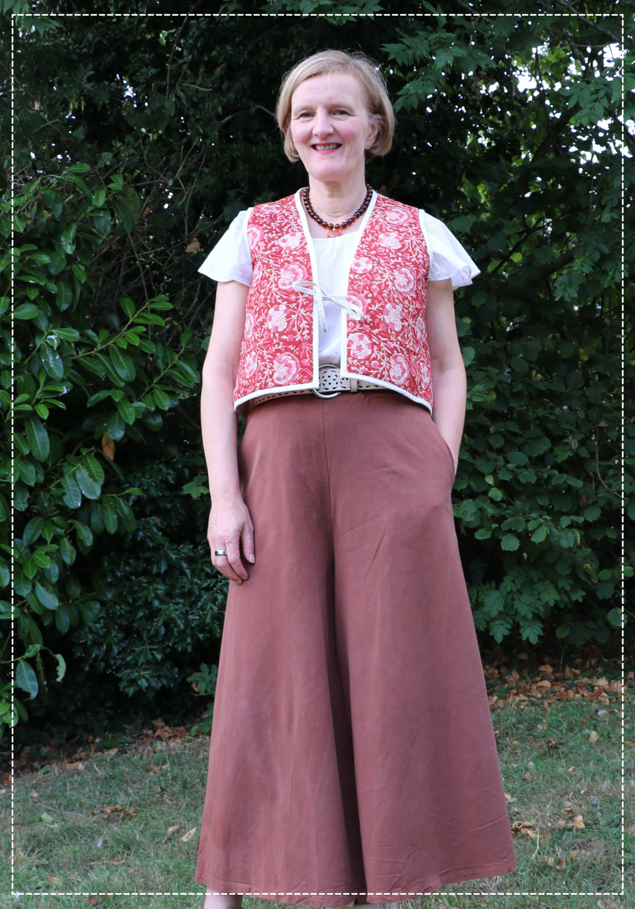 Woman wearing the Press Waistcoat sewing pattern from Bobbins and Buttons on The Fold Line. A waistcoat pattern made in cotton, linen, denim, or wool fabric, featuring front ties and bias bound edges.