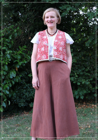 Woman wearing the Press Waistcoat sewing pattern from Bobbins and Buttons on The Fold Line. A waistcoat pattern made in cotton, linen, denim, or wool fabric, featuring front ties and bias bound edges.