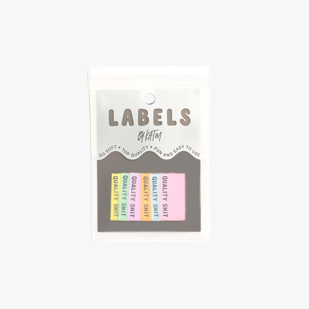 'Quality Shit (Pastel)' woven labels from Kylie & The Machine on The Fold Line. The pack includes 6 woven labels ready to be sewn into your handmade clothes.