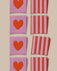 'Red Heart and Stripe Square' woven labels from Matchy Matchy Sewing Club on The Fold Line. The pack includes 8 woven labels to sew onto your handmade clothes and accessories.