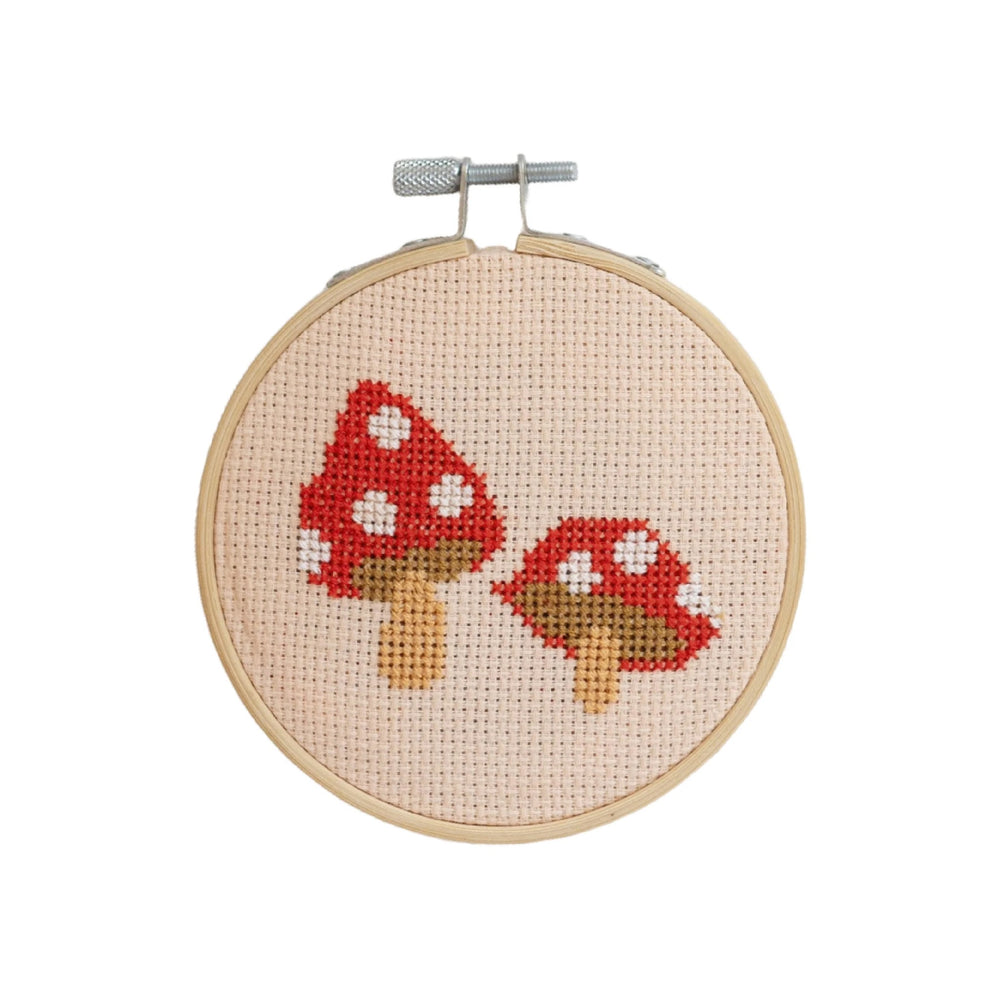 The Red Toadstool Cross Stitch Kit from Cotton Clara on The Fold Line. A contemporary mini cross stitch kit perfect for a beginner embroiderer.