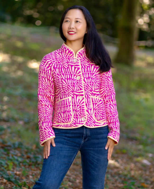 Woman wearing the Salas Jacket sewing pattern from Itch to Stitch on The Fold Line. A jacket pattern made in pre-quilted fabric, featuring a relaxed fit, dropped shoulders, collar, button front, and patch pockets.