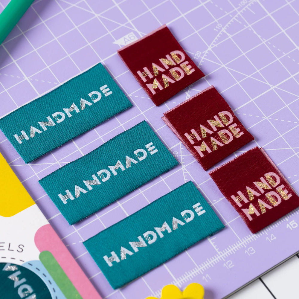 The 'Simply Handmade 4.0' woven labels from Little Rosy Cheeks on The Fold Line. The pack includes 6 labels with a berry or teal background, ready to be sewn into your handmade clothes.