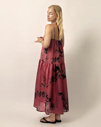 Woman wearing the Skagen Dress sewing pattern from Wardrobe by Me on The Fold Line. A dress pattern made in cotton, linen, silk or viscose fabric, featuring thin straps, a gathered neckline, and long gathered tier.