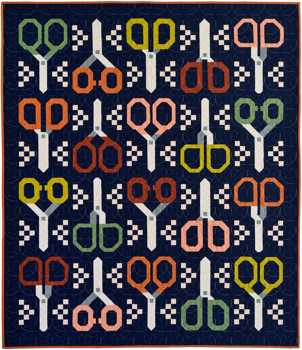 The Stay Sharp Quilt sewing pattern from Pen + Paper Patterns on The Fold Line. A quilt pattern made in quilting cotton fabric, featuring four different scissor designs.