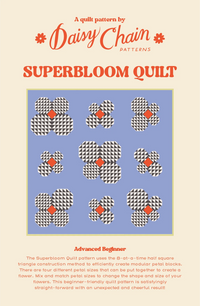 The Superbloom Quilt sewing pattern from Daisy Chain Patterns on The Fold Line. A quilt pattern made in quilting cotton fabric, featuring flowers made using the eight-at-a-time half square triangle construction method.