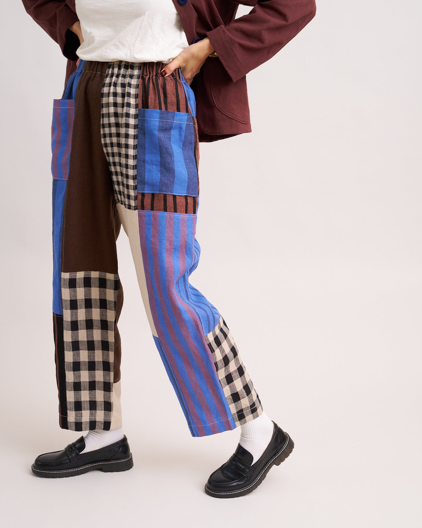 Woman wearing the Weekend Chore Pants sewing pattern from Matchy Matchy Sewing Club on The Fold Line. A trousers pattern made in linen, cotton, denim, twill, or canvas fabric, featuring a relaxed fit, high rise, elastic waist, and oversized pockets.