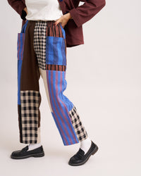 Woman wearing the Weekend Chore Pants sewing pattern from Matchy Matchy Sewing Club on The Fold Line. A trousers pattern made in linen, cotton, denim, twill, or canvas fabric, featuring a relaxed fit, high rise, elastic waist, and oversized pockets.