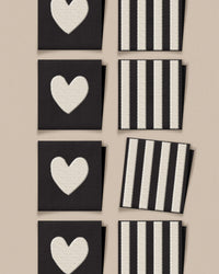 'White Heart and Stripe Square' woven labels from Matchy Matchy Sewing Club on The Fold Line. The pack includes 8 woven labels to sew onto your handmade clothes and accessories.