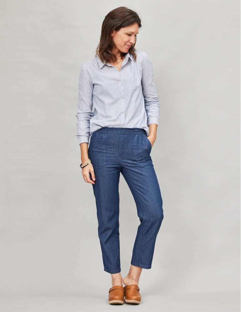 Woman wearing the Équilibre Pants sewing pattern from Atelier Scämmit on The Fold Line. A pants pattern made in serge or denim fabric, featuring an elastic waist, mock fly, and pockets.