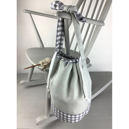 Photo showing the Chamomile Project Bag sewing pattern from Lasenby on The Fold Line. A drawstring bag pattern made in canvas, linen, quilting cotton, twill, duck, denim, thin tweed, and Tana lawn fabrics, featuring internal customisable pockets, loops fo