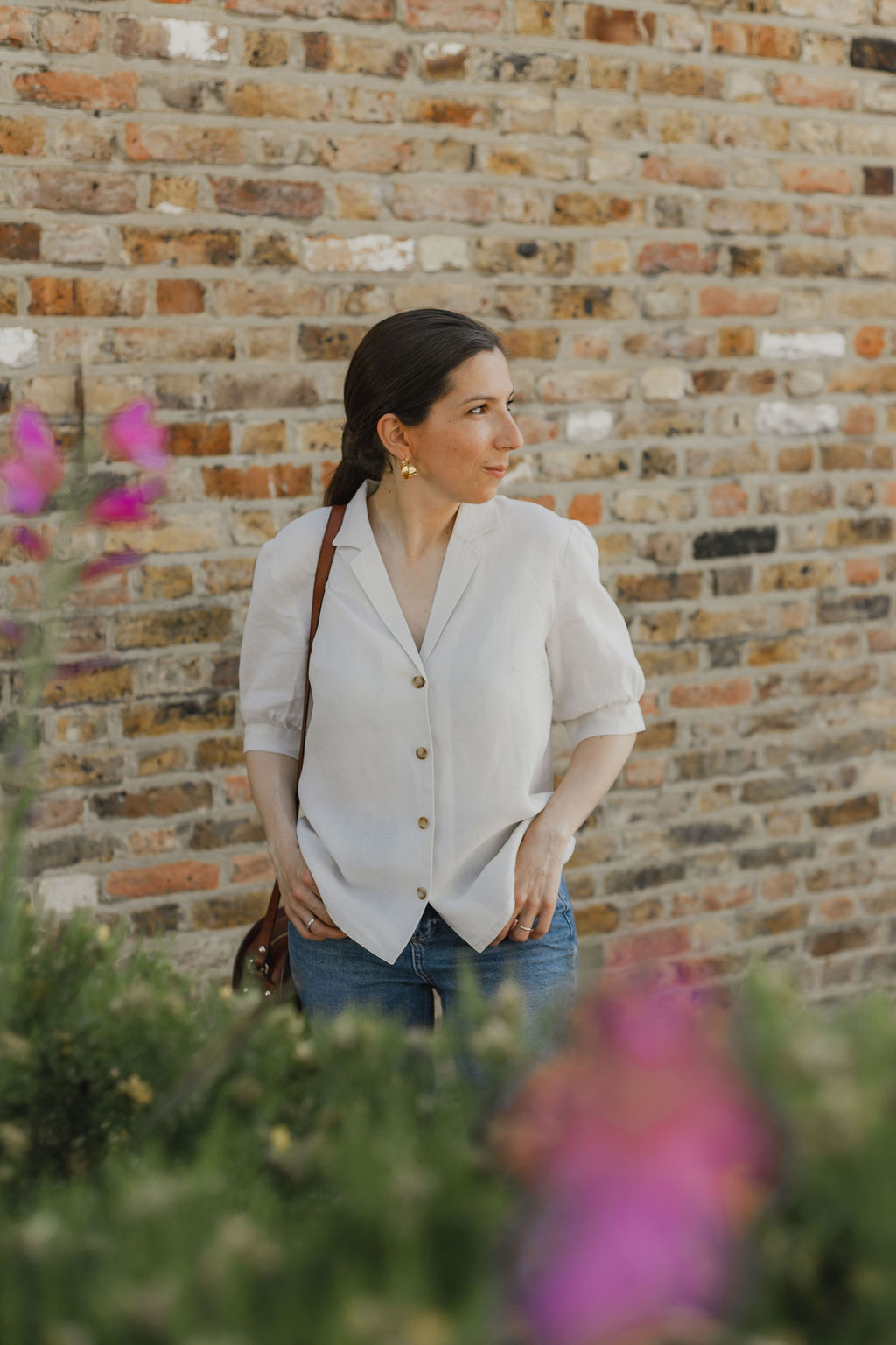 Woman wearing the Lucette Blouse and Dress sewing pattern from Camimade on The Fold Line. A blouse pattern made in cotton poplin, cotton lawn, cotton sateen, soft linen, cotton double gauze, chambray or cotton dobby fabrics, featuring front button closure