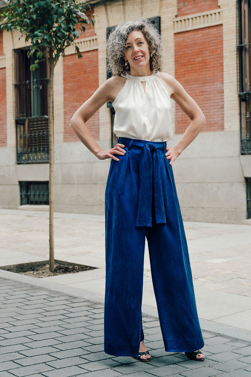 Woman wearing the Cannes Wide-legged Trousers sewing pattern from Liesl + Co on The Fold Line. A trouser pattern made in cotton rayon, linen, silk, tropical wool or crepe fabrics, featuring a high-waist, pleated-front, ultra-wide-legs, fly front closure, 