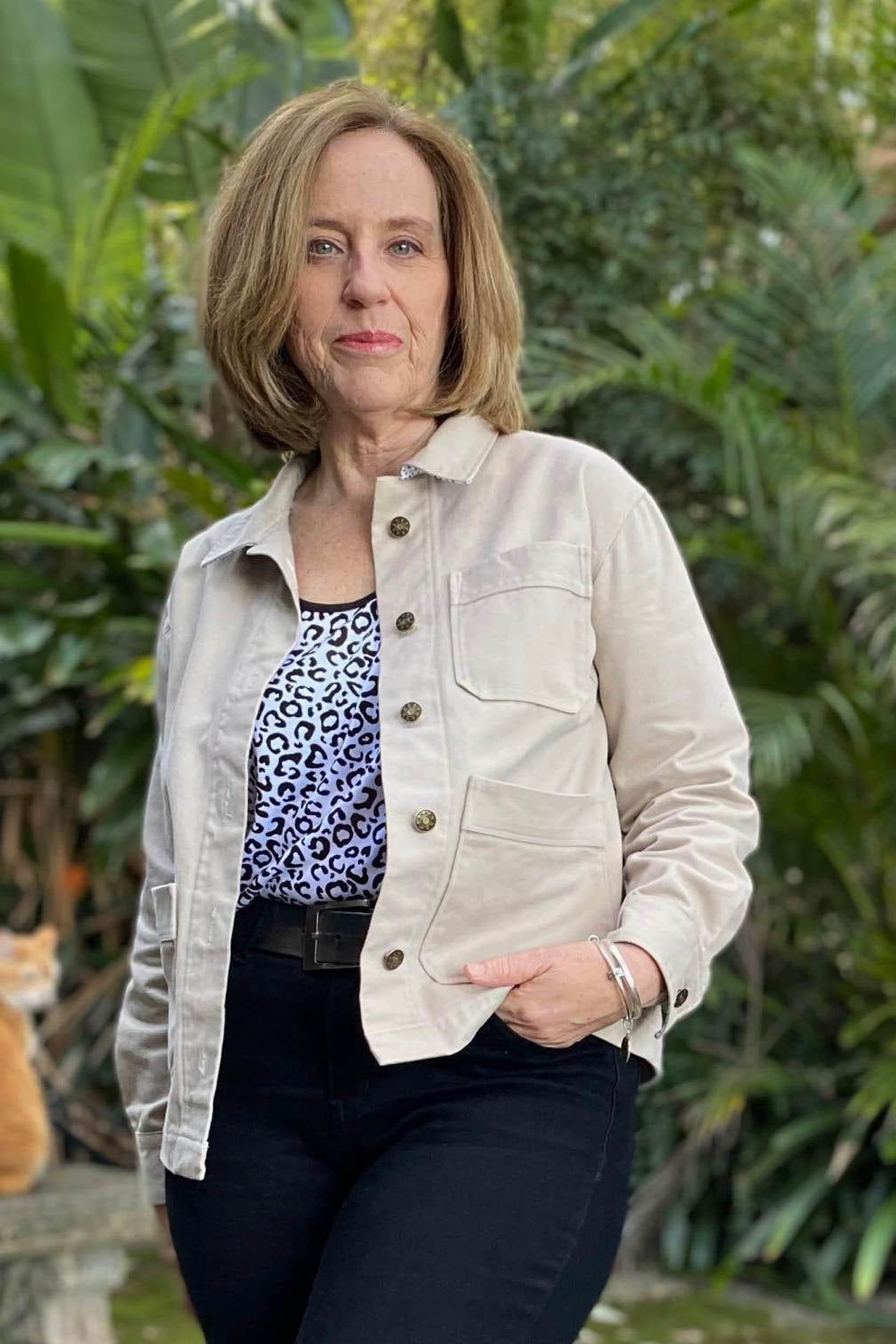 Woman wearing Canvas Jacket sewing pattern from Wardrobe by Me on The Fold Line. A jacket pattern made in canvas, denim, corduroy, cotton drill, linen or wool fabrics, featuring a boxy fit, two-piece sleeves, 3 patch pockets, yoke, collar, front button cl