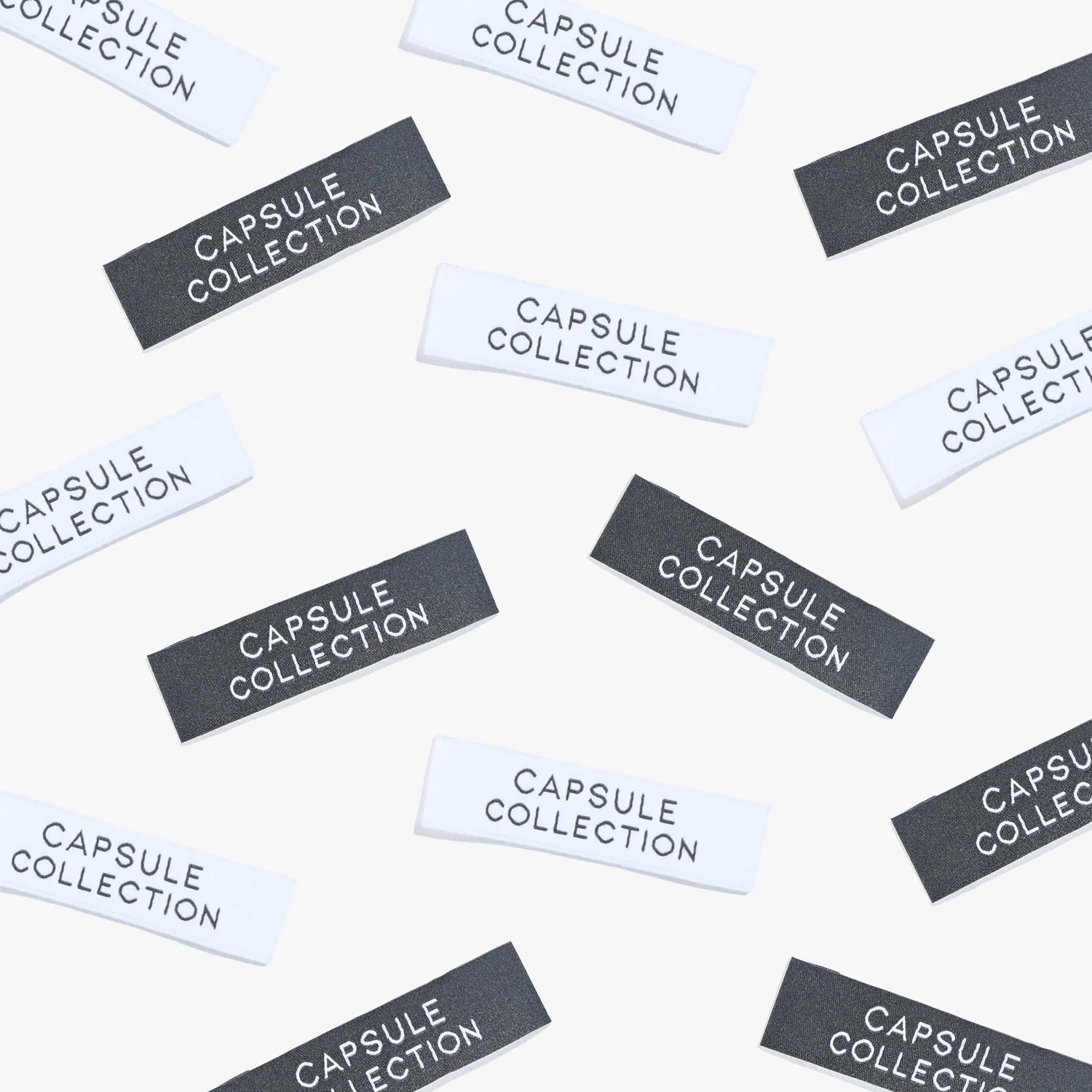 Photo showing ‘Capsule collection’ Labels from Kylie & The Machine on The Fold Line. A washable, durable, and non-scratchy label. Included are 6 woven labels: 3 x white background with black text and 3 x black background with white text background. They a