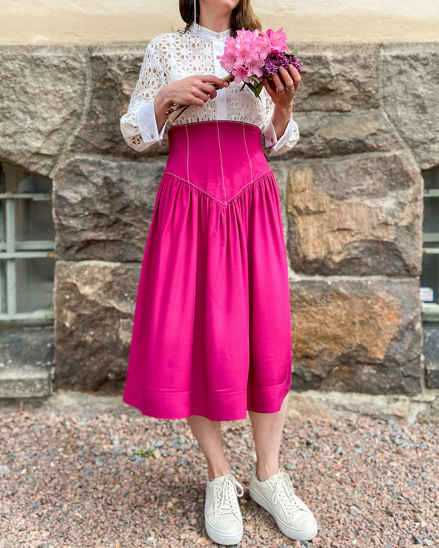 Woman wearing the Carrie Skirt sewing pattern from Vanessa Hansen on The Fold Line. A skirt pattern made in cottons, light wool blends, softened linen, viscose/rayon or silk fabrics, featuring a very high-waist, gathered skirt with panelled yoke, invisibl