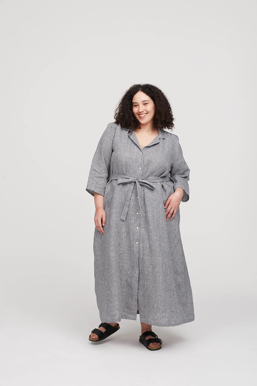 Woman wearing the Celia Dress sewing pattern from The Modern Sewing Co on The Fold Line. A shirt dress pattern made in cottons, linens, tencel, silk, denim, corduroy or wool suiting fabrics, featuring an A-line cut, relaxed fit with fitted shoulders, two-