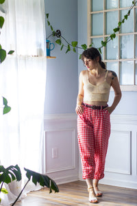 Woman wearing the Chandler Trouser sewing pattern from Untitled Thoughts on The Fold Line. A trouser pattern made in linen, chambray, cotton poplin, rayons, tropical weight wool, wool suiting or silk, flannel fabrics, featuring extra add-ons such as a new