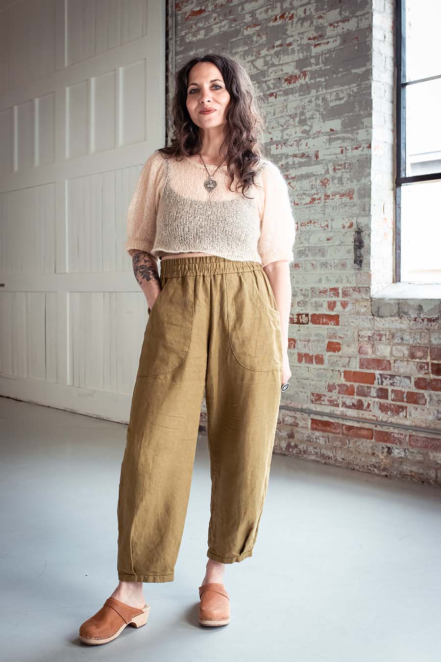 Women wearing the Chanterelle Pants sewing pattern from Sew Liberated on The Fold Line. A trouser pattern made in chambray, viscose-linen, sandwashed linen or cotton, ikat, or light twill fabrics, featuring an elasticated waist, front and back patch pocke