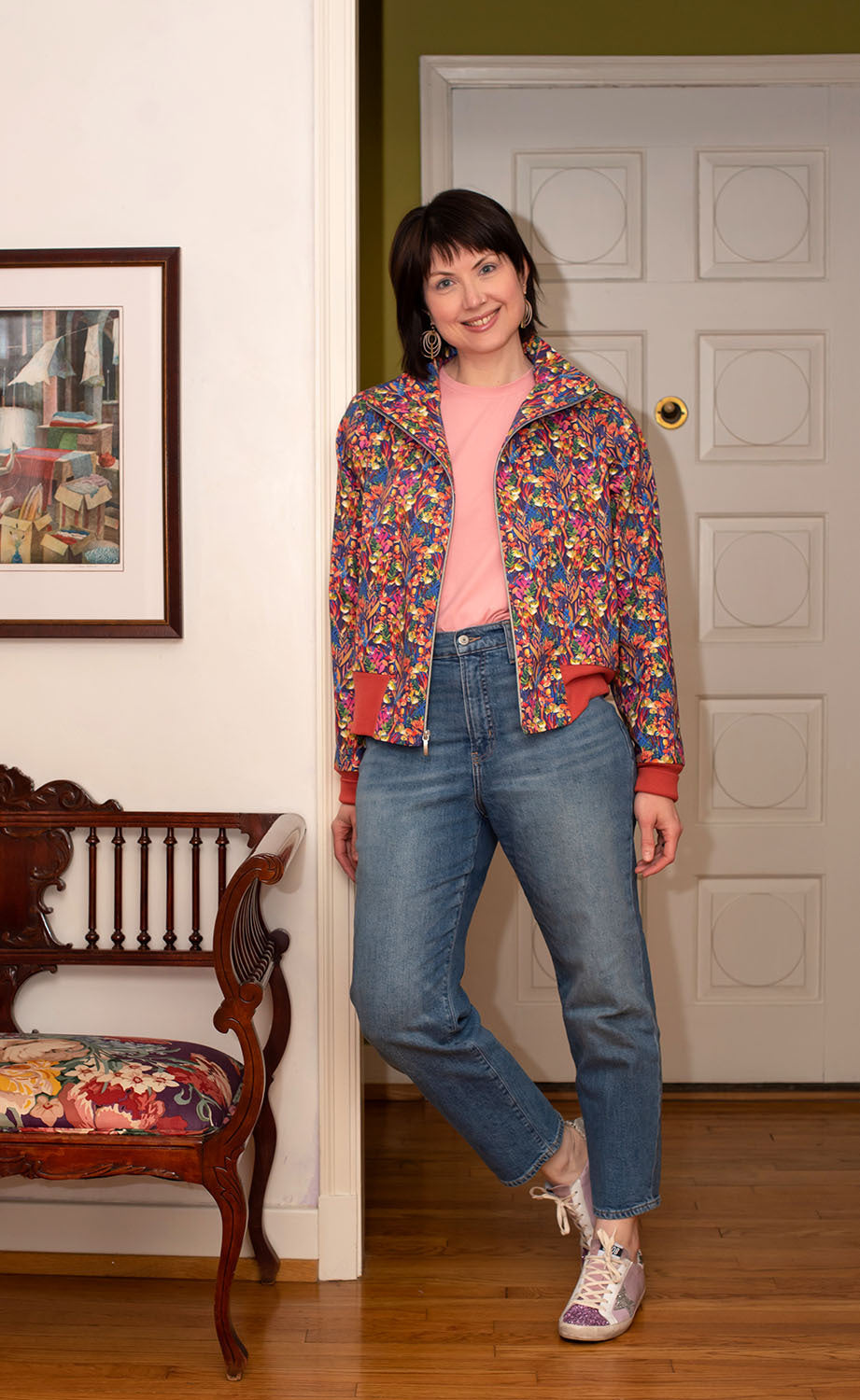 Woman wearing the Charlie Bomber Jacket sewing pattern from The Sewing Workshop on The Fold Line. A jacket pattern made in cotton sateen or cotton twill fabrics, featuring a semi-fit, hip-length, front zipper closure, ribbed hip band and full length sleev