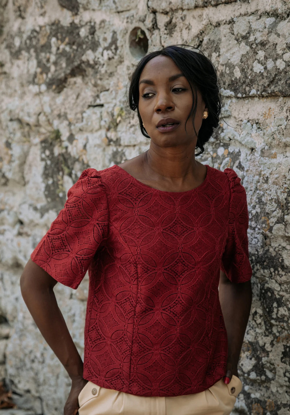 Woman wearing the Cicadella Blouse sewing pattern from Maison Fauve on The Fold Line. A blouse pattern made in viscose, soft jacquard, tencel, cotton, crepe, poplin, satin or twill fabrics, featuring princess seams, scooped neckline, short puff sleeves, f