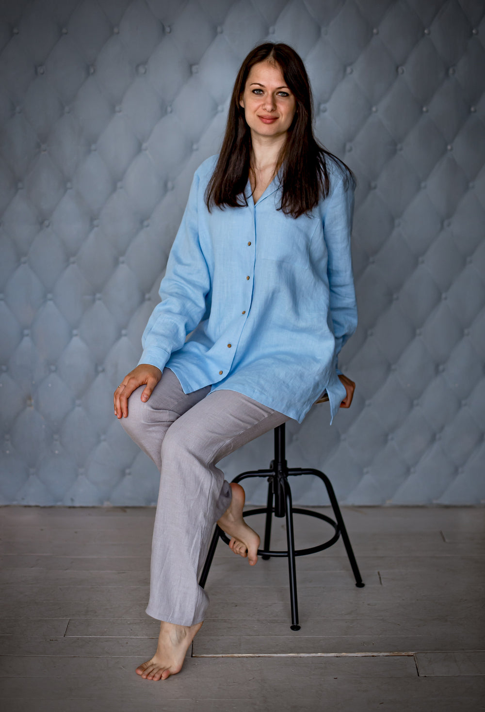 Woman wearing the Coco Shirt sewing pattern from Kates Sewing Patterns on The Fold Line. A shirt pattern made in cotton, linen, silk or viscose fabrics, featuring a wide straight cut, back yoke, front button placket, pyjama-style collar, patch pocket, cuf