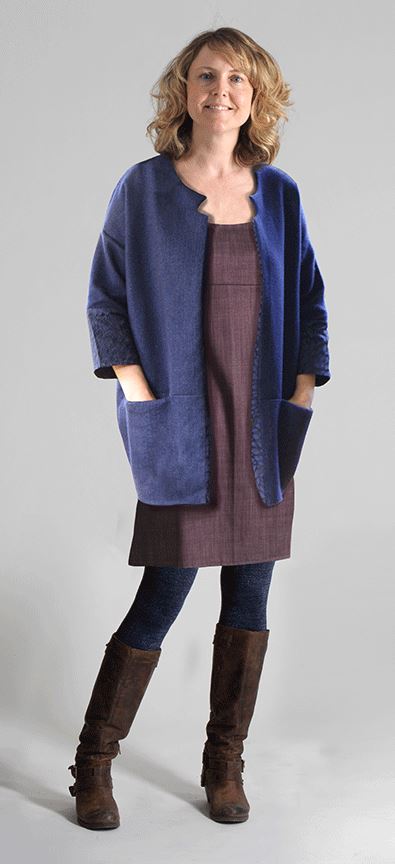 Woman wearing the Cocoon Jacket sewing pattern from Sew Different on The Fold Line. A jacket pattern made in wool, heavy cotton, denim, gabardine, felt or heavy knit fabrics, featuring an oversized fit, cocoon shape, over large on the shoulders, ¾ length 