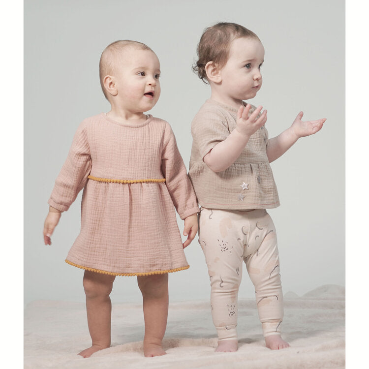 Toddlers wearing the Lennon Tunic & Dress sewing pattern from Pattern Paper Scissors on The Fold Line. A T-shirt pattern made in cotton, viscose, denim, double gauze, linen or crepe fabrics, featuring long or short sleeves, round neckline, raised waistlin