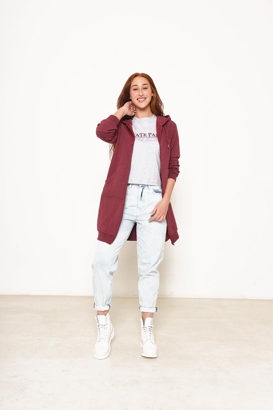 Woman wearing the Hazel Hoodie sewing pattern from Fibre Mood on The Fold Line. A hoodie pattern made in sweatshirt fabric, french terry, or ponte roma fabrics, featuring a longer length, hood with drawstring, ribbed hem and cuffs, front zip closure and k