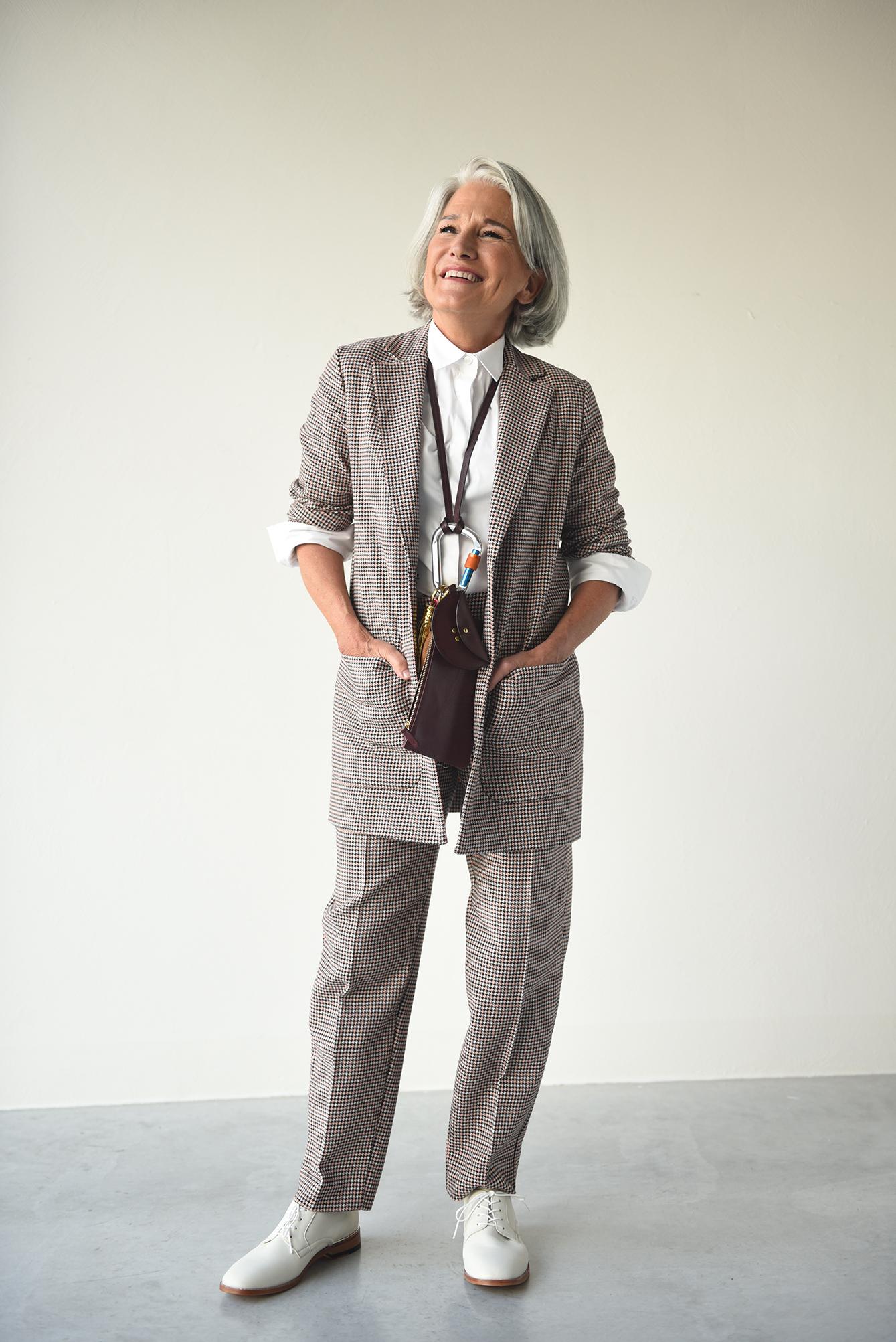 Woman wearing the Billie Trousers sewing pattern from Fibre Mood on The Fold Line. A trouser pattern made in cotton, wool or suiting fabrics, featuring side seam pockets, waistband and front zip closure, waistband sits just below natural waist, tapered le